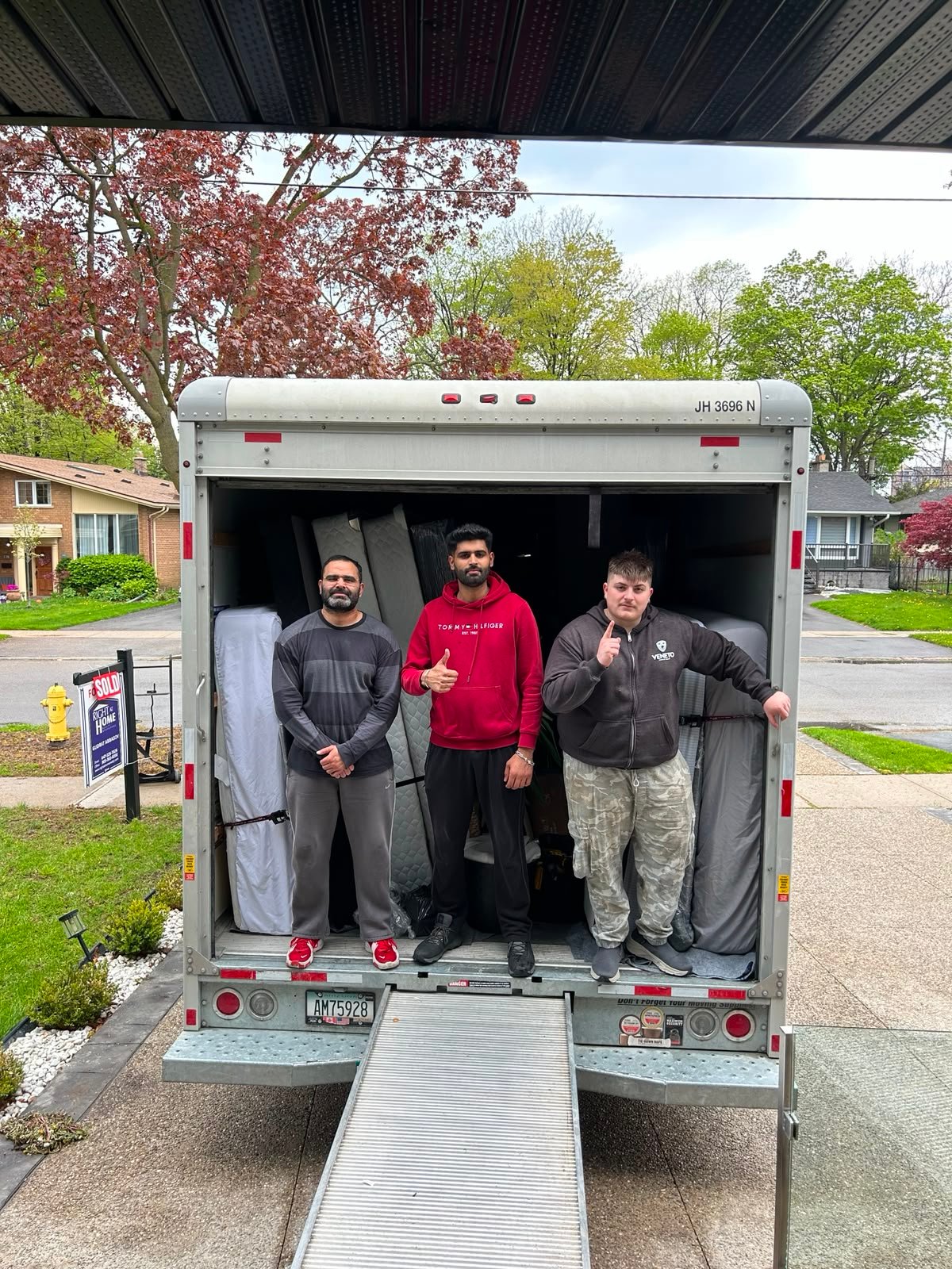 Coolie No 1 Movers professional team loading a moving truck in Ontario